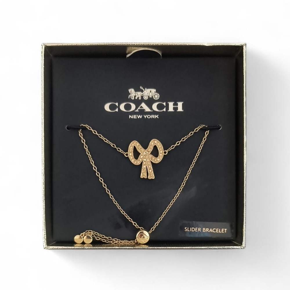 Coach Bow Tie Gold-tone Pendant Slider Bracelet